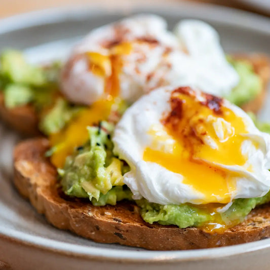 Perfectly Poached Eggs with Smashed Avocado on Sour Dough